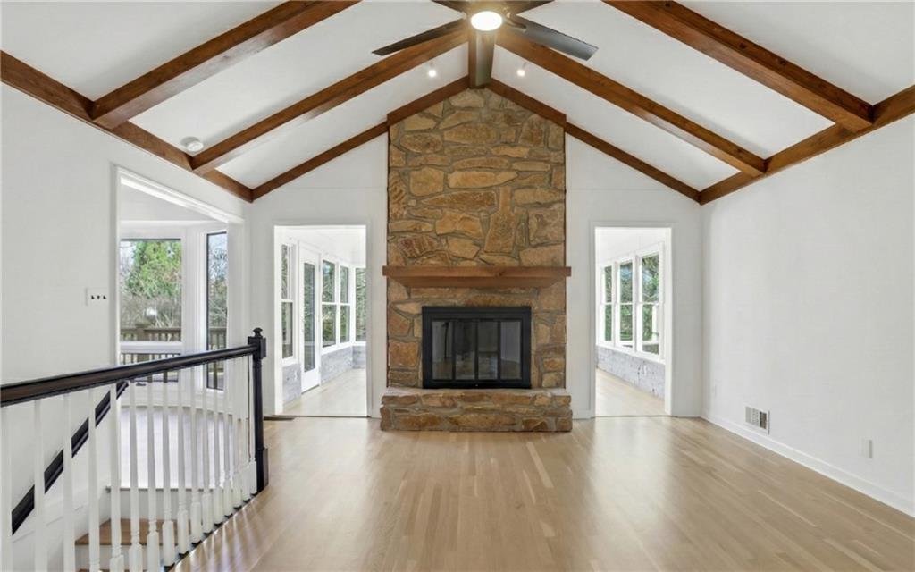 600 Rounsaville Road Roswell, GA 30076 - Photo 3 of 45 a view of a livingroom with wooden floor and a fireplace