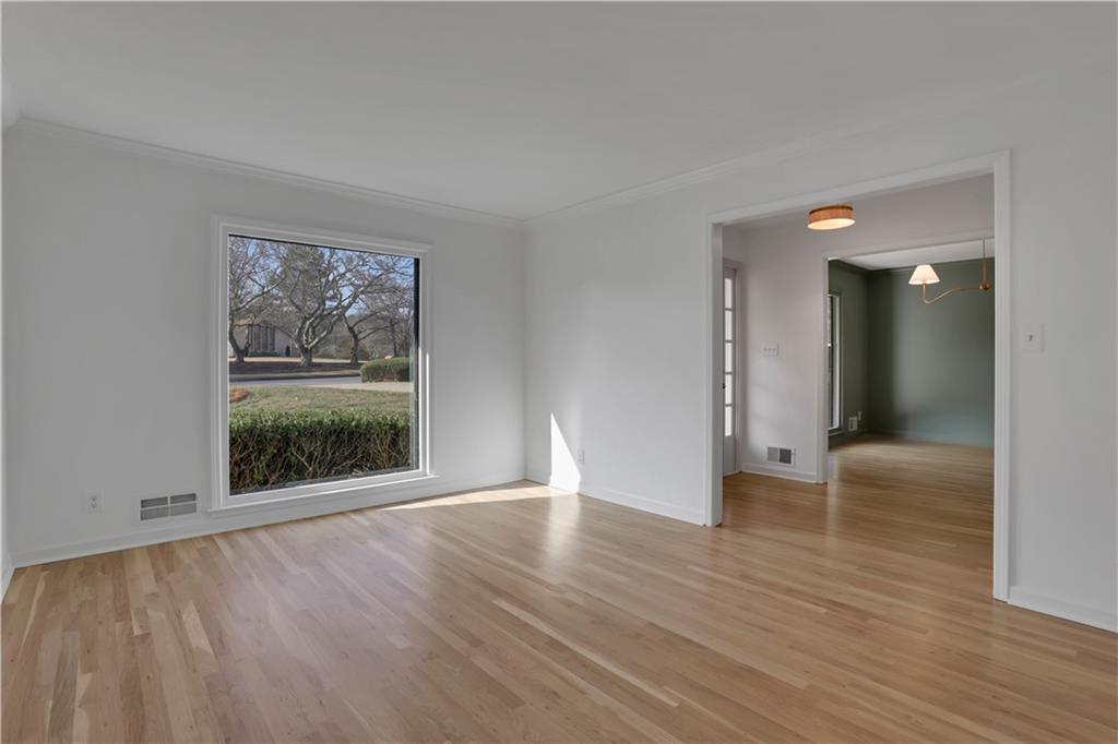 600 Rounsaville Road Roswell, GA 30076 - Photo 8 of 45 wooden floor in an empty room with a window