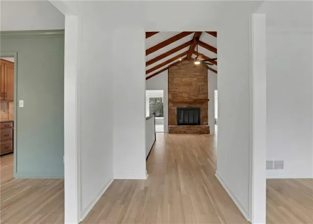 a kitchen with stainless steel appliances granite countertop a stove microwave and refrigerator