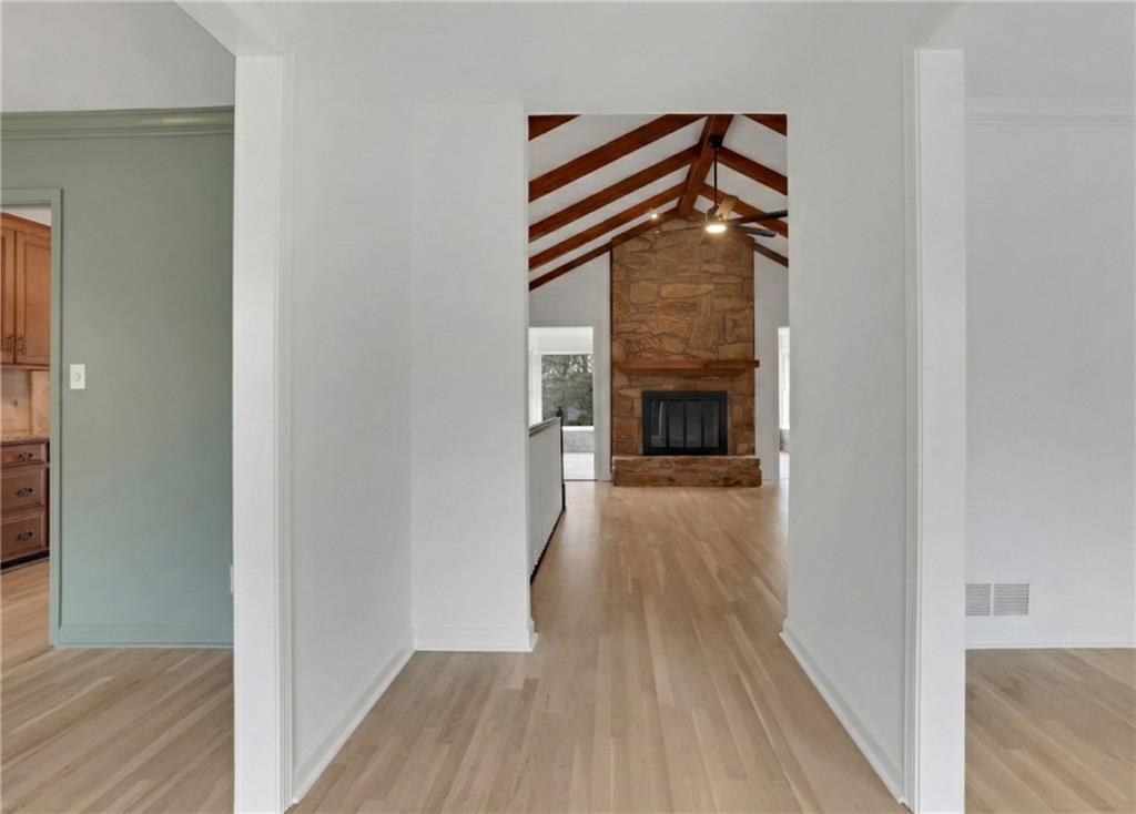 600 Rounsaville Road Roswell, GA 30076 - Photo 9 of 45 a view of a livingroom with wooden floor and a fireplace