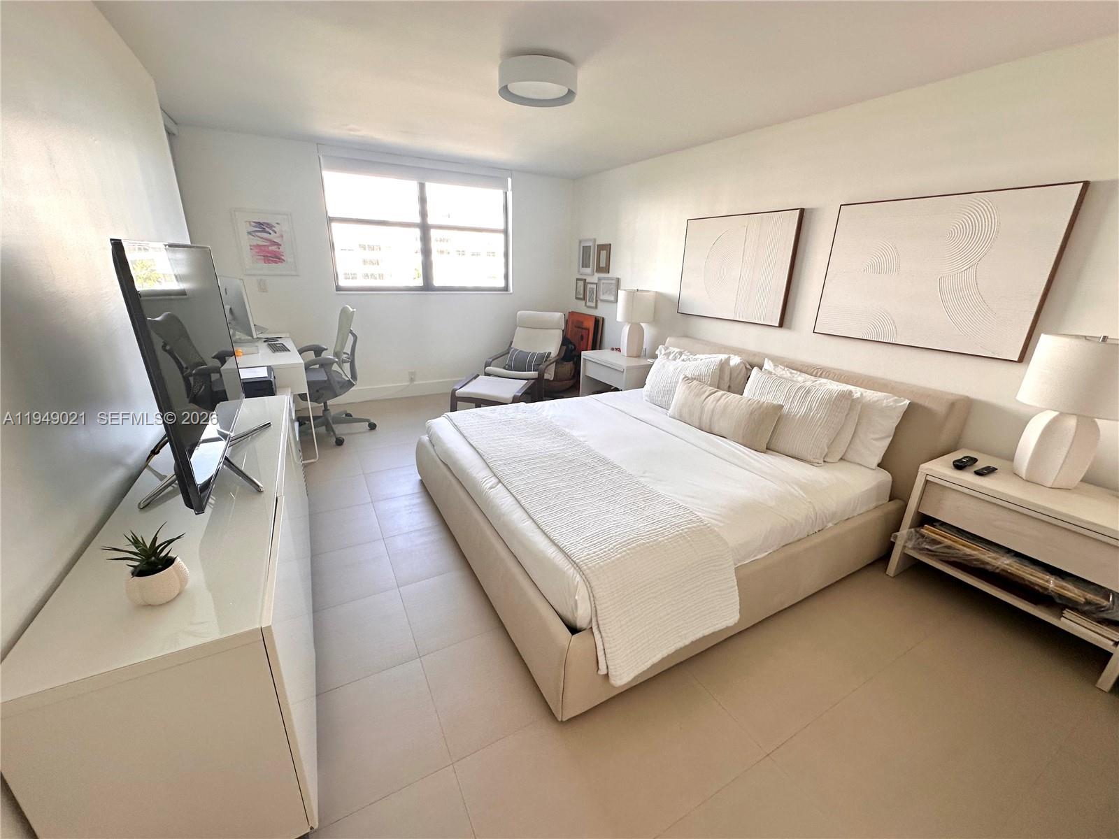 170 Ocean Ln Drive, Unit 809 Key Biscayne, FL 33149 - Photo 13 of 31 a bed room with a bed and a chair