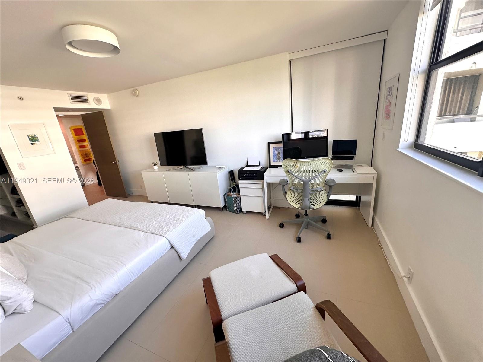 170 Ocean Ln Drive, Unit 809 Key Biscayne, FL 33149 - Photo 15 of 31 a hotel room with two beds and a couch