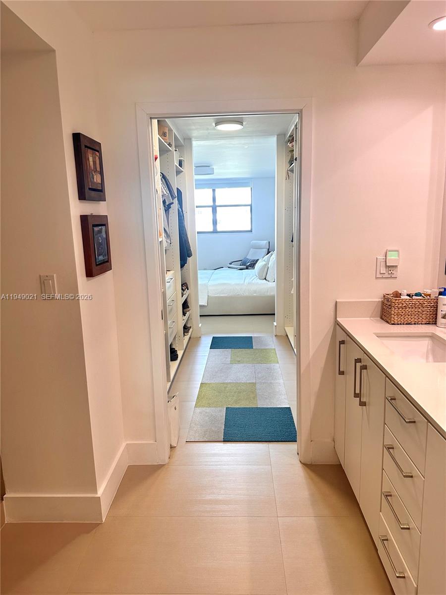 170 Ocean Ln Drive, Unit 809 Key Biscayne, FL 33149 - Photo 21 of 31 a bathroom with a tub sink and mirror