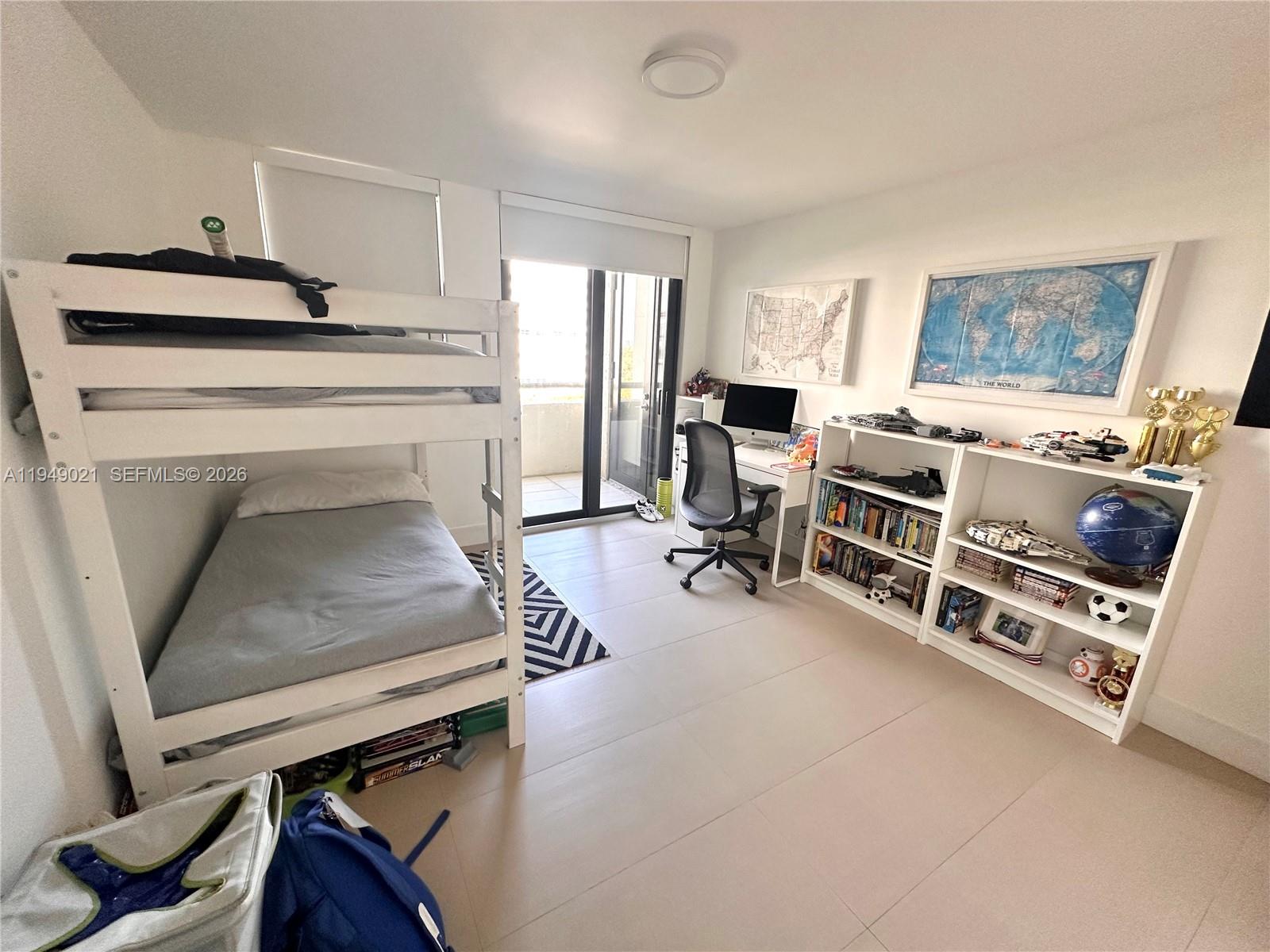 170 Ocean Ln Drive, Unit 809 Key Biscayne, FL 33149 - Photo 23 of 31 a living room with furniture and a flat screen tv