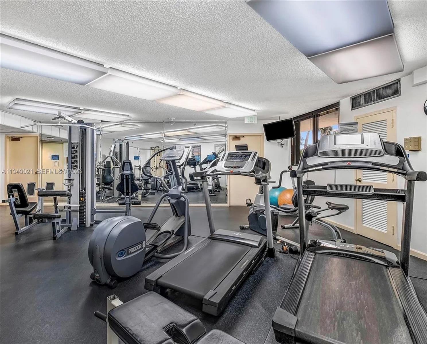 170 Ocean Ln Drive, Unit 809 Key Biscayne, FL 33149 - Photo 30 of 31 a view of a room with gym equipment