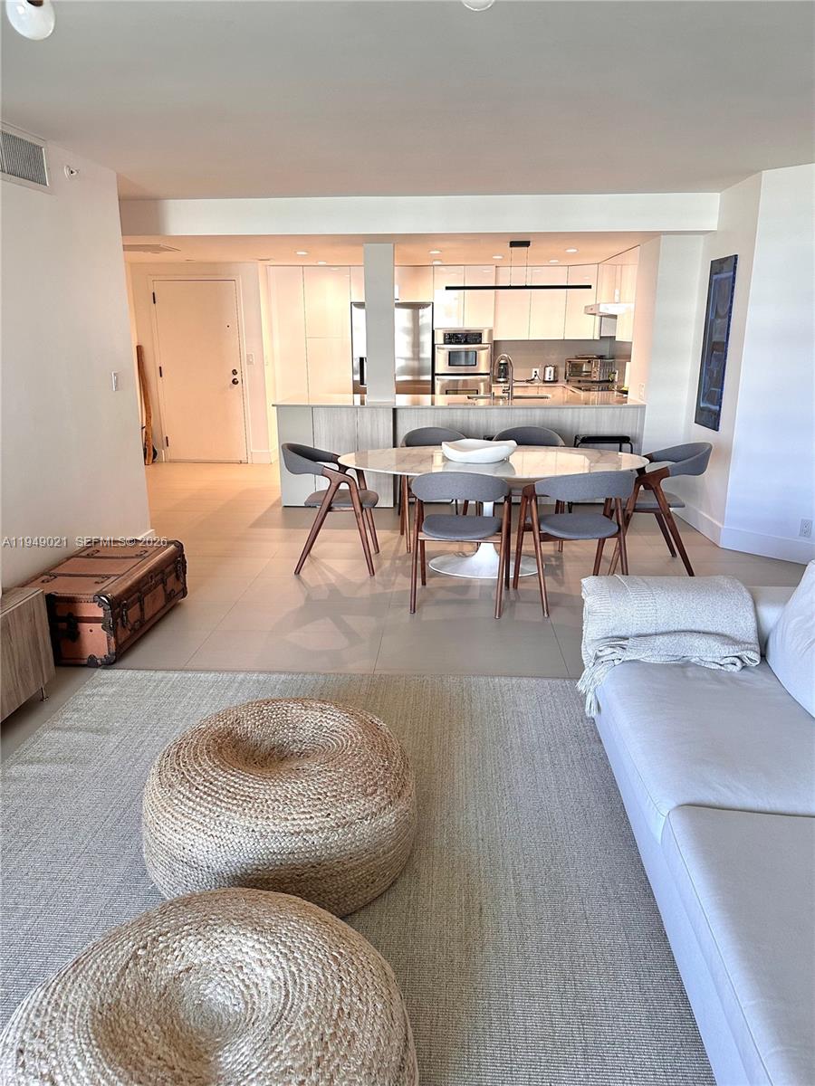 170 Ocean Ln Drive, Unit 809 Key Biscayne, FL 33149 - Photo 3 of 31 a living room with furniture and a large window