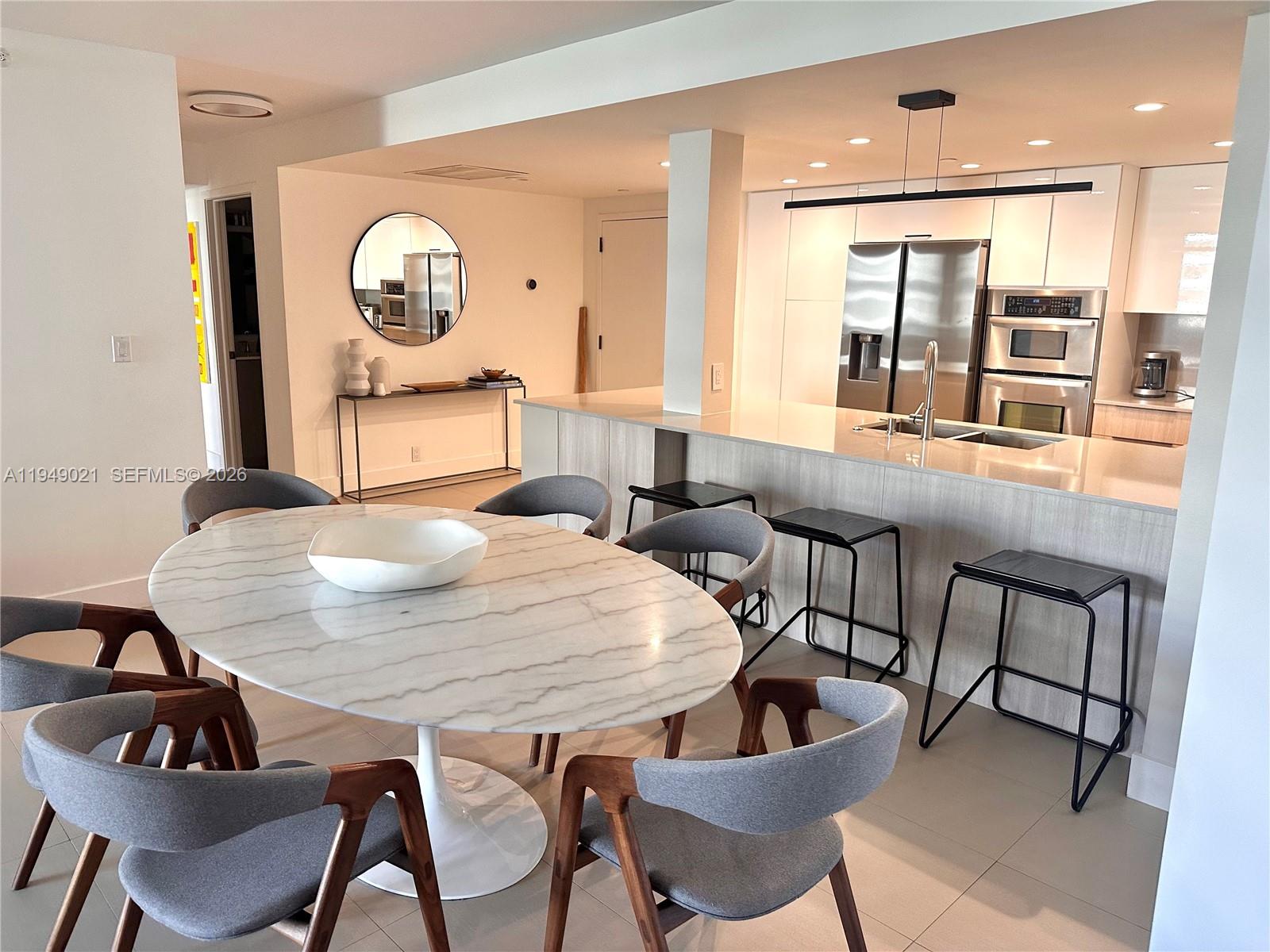 170 Ocean Ln Drive, Unit 809 Key Biscayne, FL 33149 - Photo 6 of 31 a living room with furniture and a wooden floor