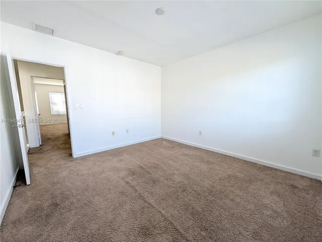 an empty room with a bathroom