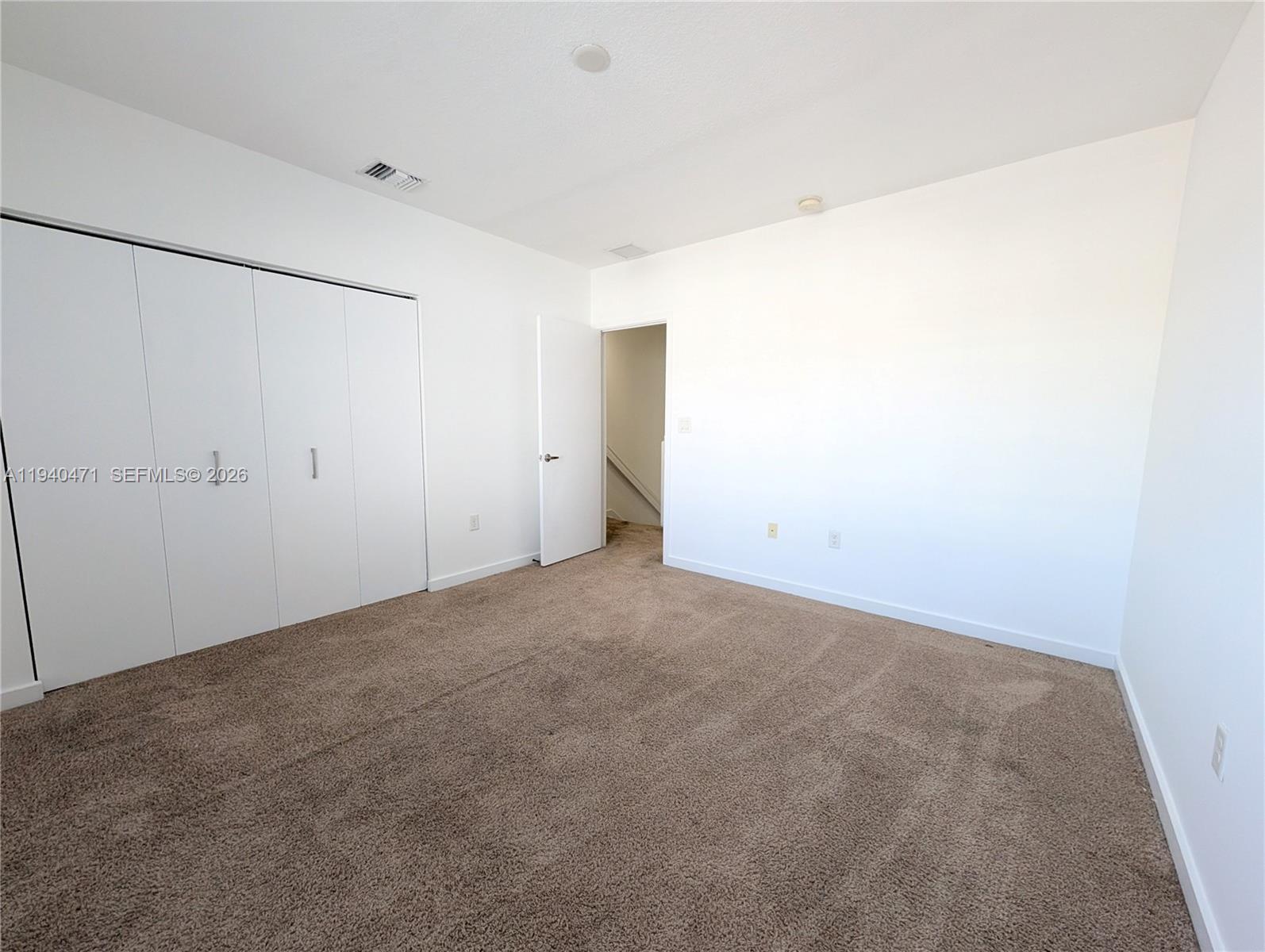 3484 Northwest 13th Street, Unit 3484 Lauderhill, FL 33311 - Photo 18 of 49 a view of an empty room