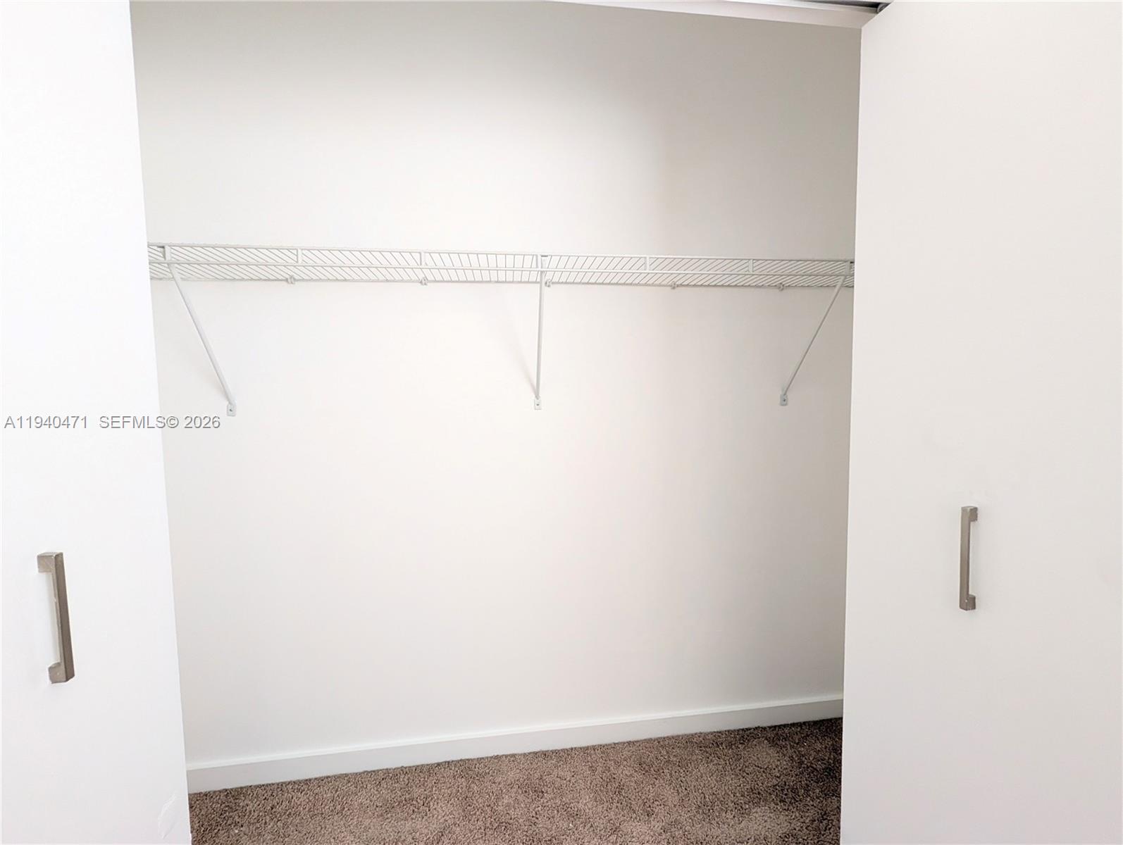 3484 Northwest 13th Street, Unit 3484 Lauderhill, FL 33311 - Photo 28 of 49 a view of small space with racks on the wall