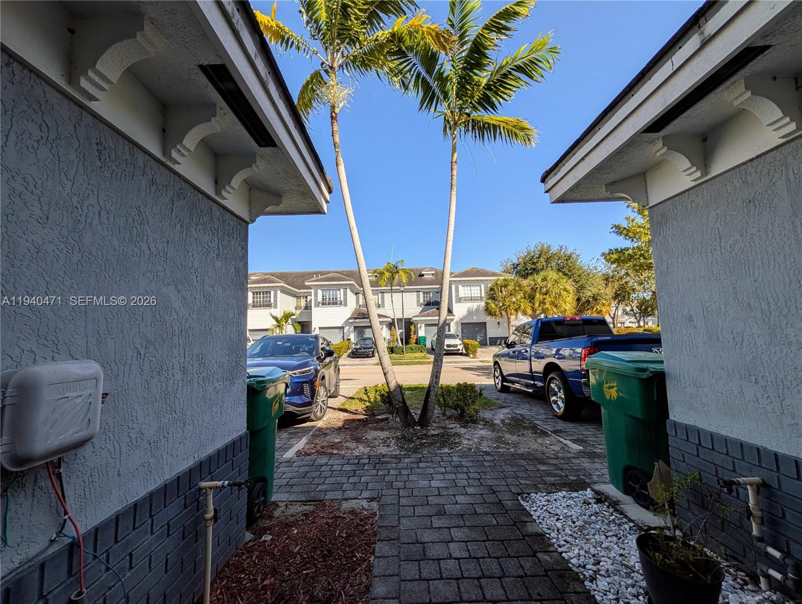 3484 Northwest 13th Street, Unit 3484 Lauderhill, FL 33311 - Photo 35 of 49 a view of balcony with chairs and potted plants