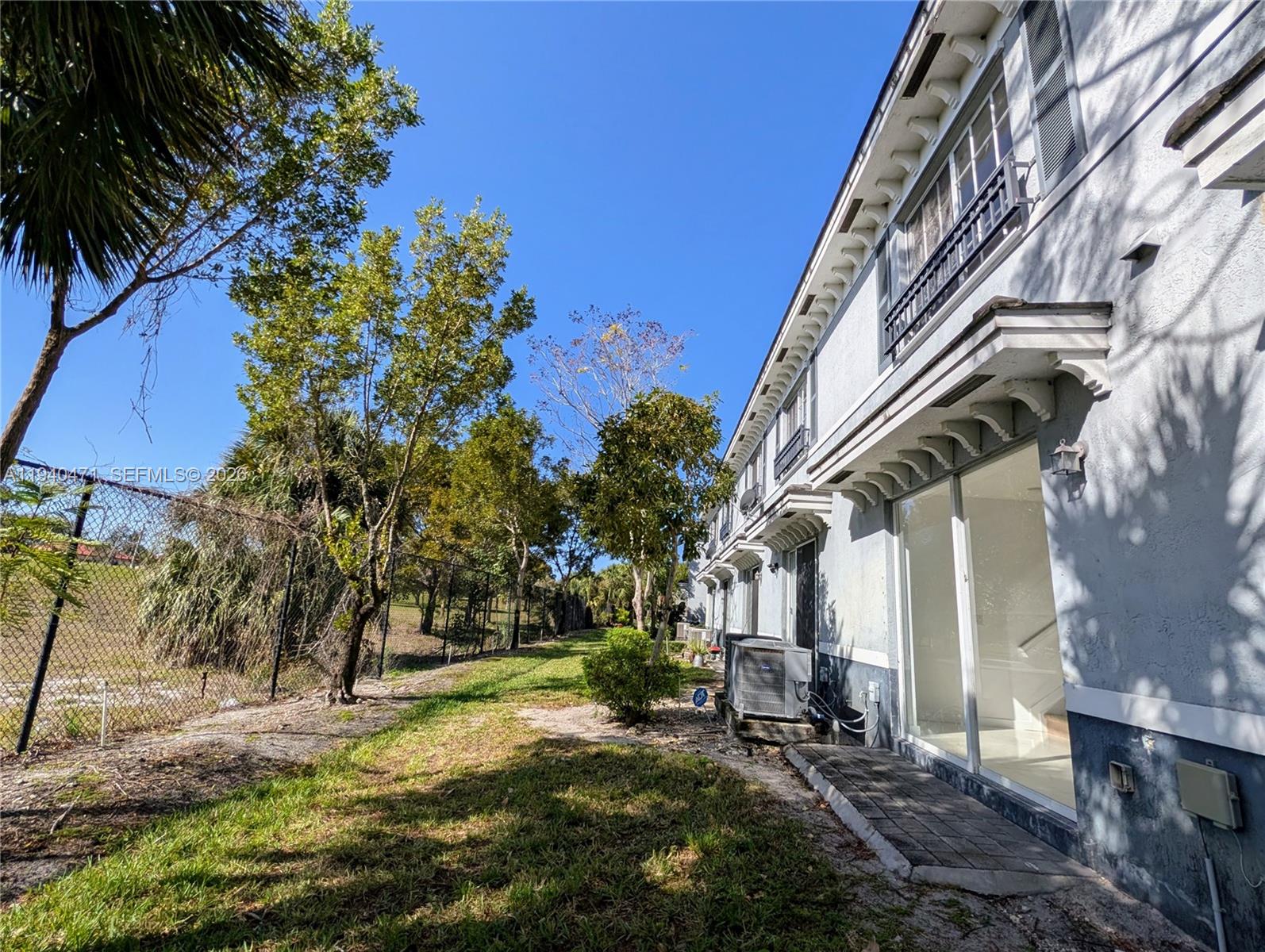 3484 Northwest 13th Street, Unit 3484 Lauderhill, FL 33311 - Photo 44 of 49 front view of a house with a yard