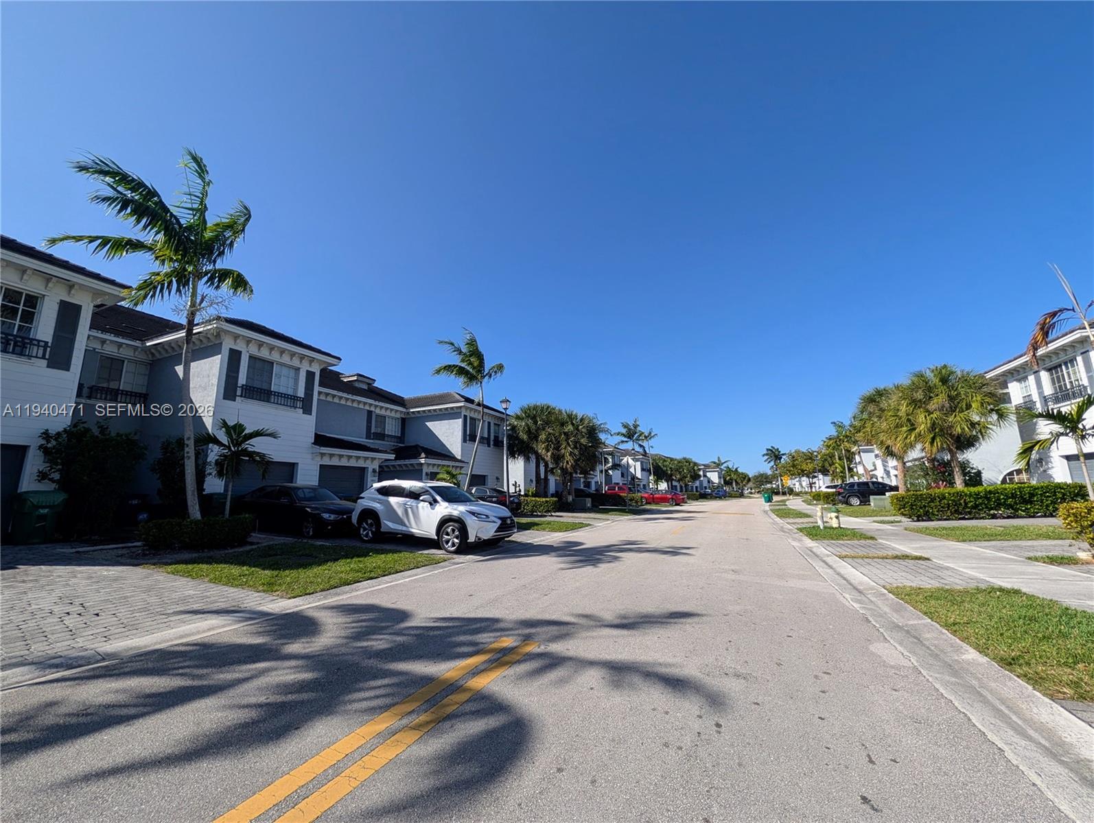 3484 Northwest 13th Street, Unit 3484 Lauderhill, FL 33311 - Photo 46 of 49 a view of a street with cars on road