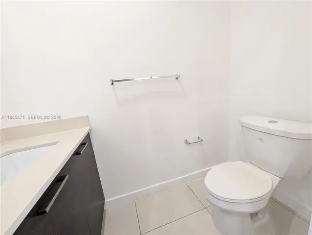 a bathroom with a sink a toilet and a shower
