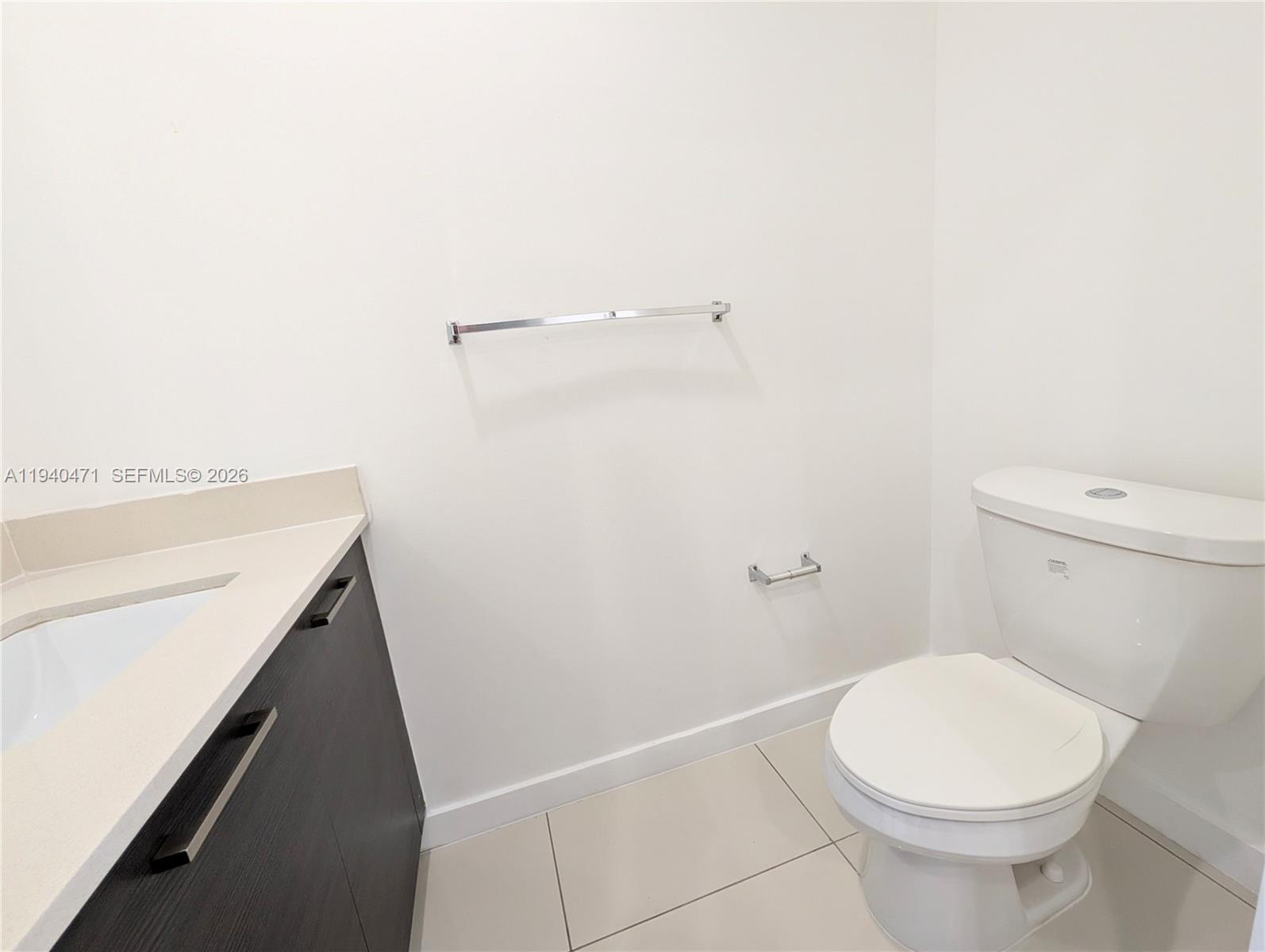 3484 Northwest 13th Street, Unit 3484 Lauderhill, FL 33311 - Photo 10 of 49 a bathroom with a sink a toilet and a shower