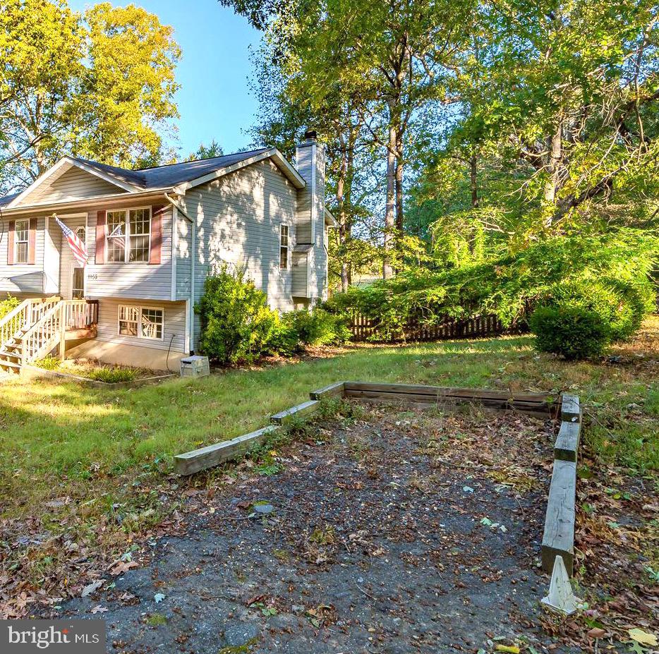 11109 Rawhide Road Lusby, MD 20657 - Photo 2 of 41 Extra parking space to the right of the home
