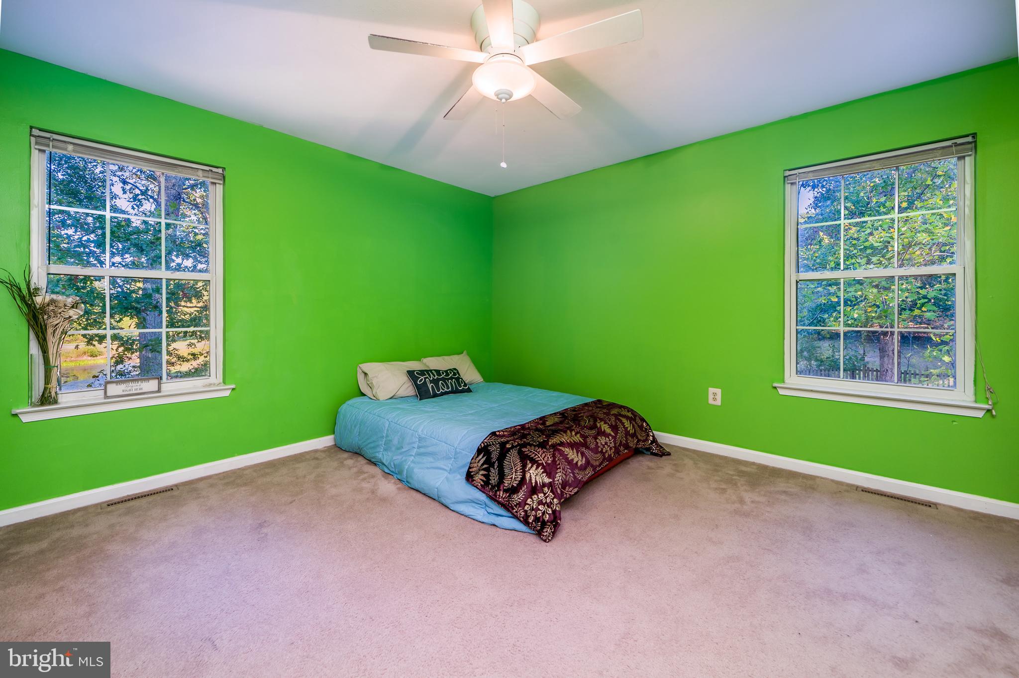 11109 Rawhide Road Lusby, MD 20657 - Photo 11 of 41 Master bedroom with view of golf course