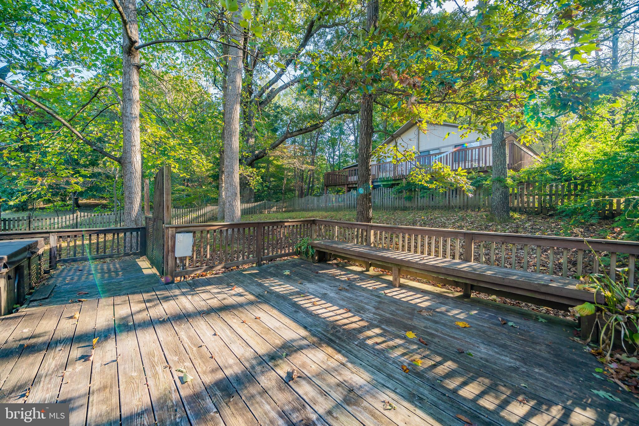 11109 Rawhide Road Lusby, MD 20657 - Photo 32 of 41 Large back deck with built in bench