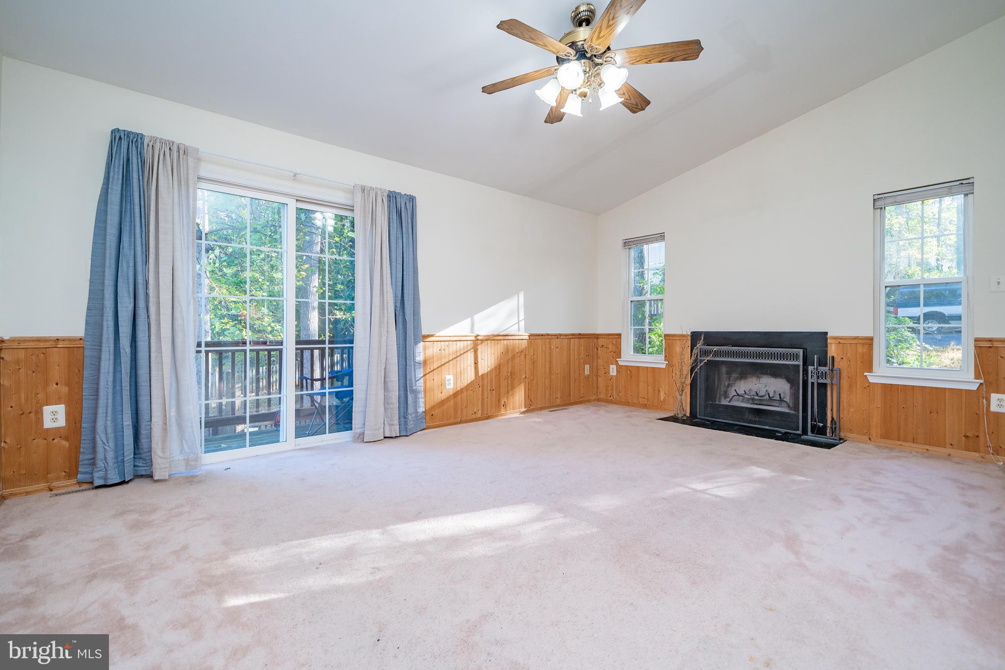11109 Rawhide Road Lusby, MD 20657 - Photo 8 of 41 Living room with wood burning fireplace