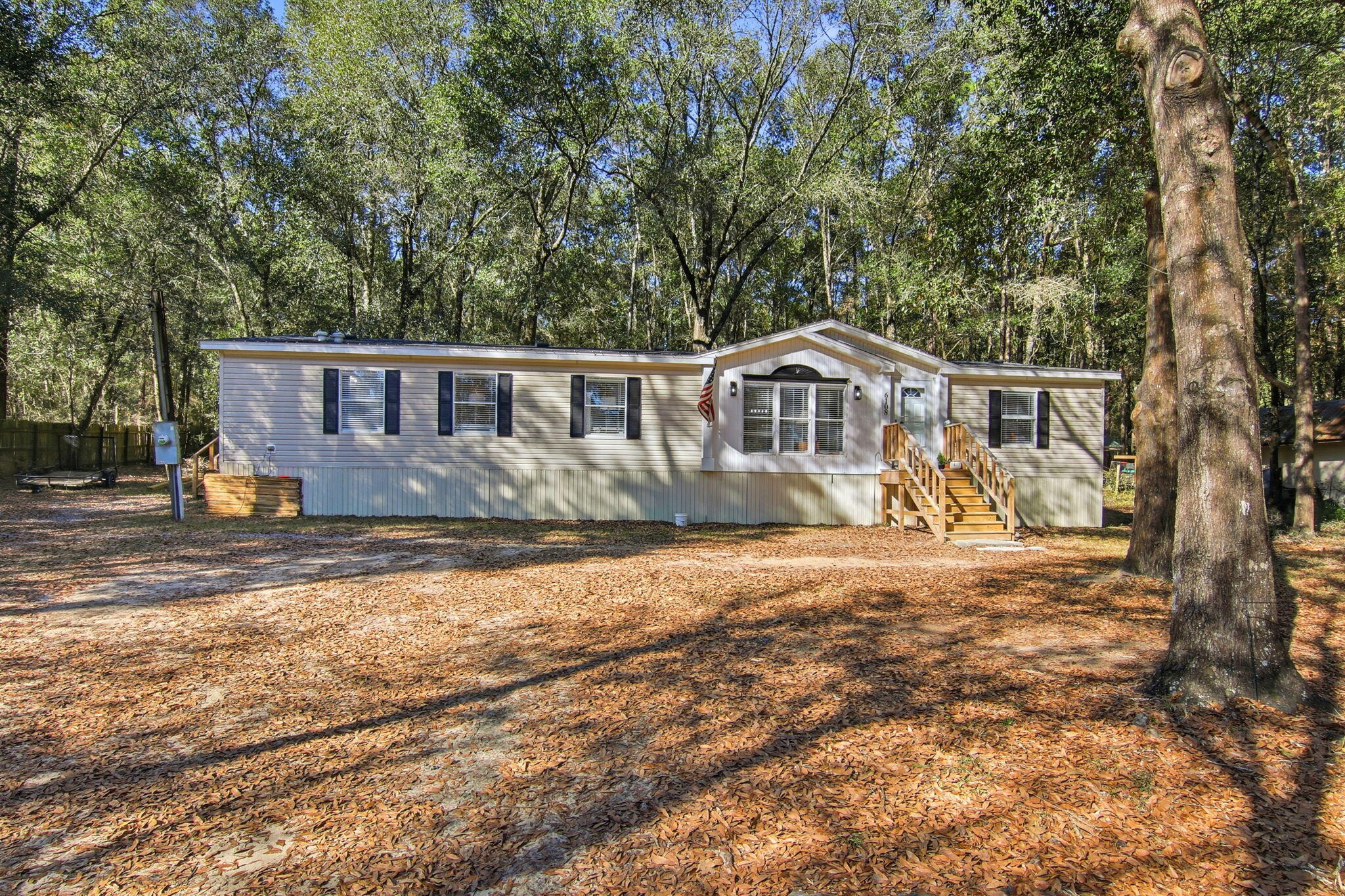 6108 Old River Road Baker, FL 32531 - Photo 7 of 40 a view of a house with backyard and sitting area