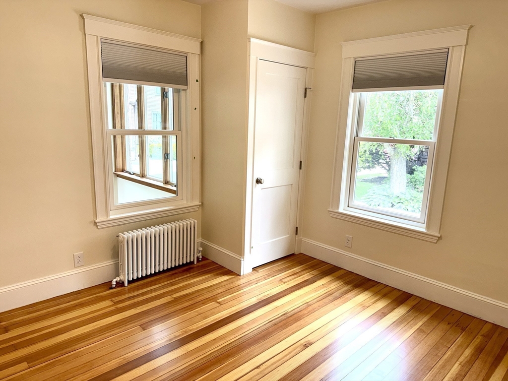 39 Newman Road Malden, MA 02148 - Photo 15 of 27 a view of an empty room with wooden floor and a window