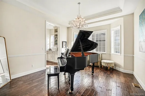 a view of entryway with wooden floor and front door