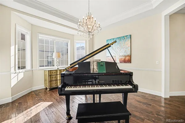 a bedroom with a bed and a table with potted plant