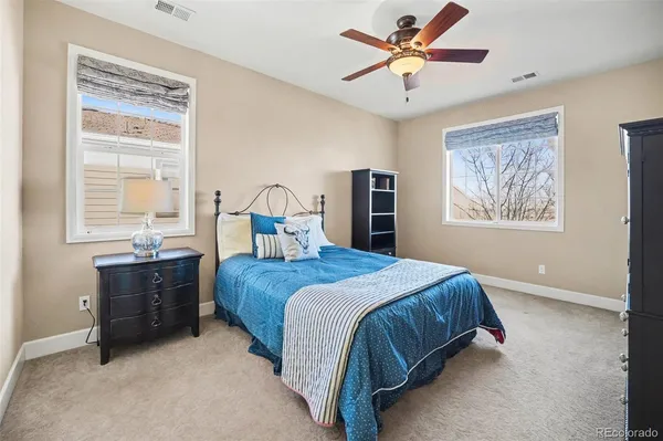 a bathroom with a granite countertop sink mirror and a bathtub