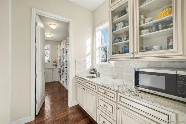 a living room with furniture a window and a fireplace