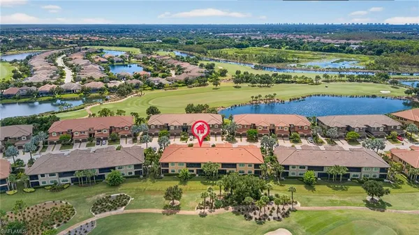 an aerial view of residential houses and outdoor space