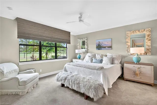 a spacious bedroom with a bed and a couch