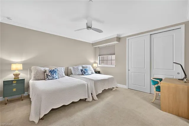 a bedroom with a bed and a cabinets