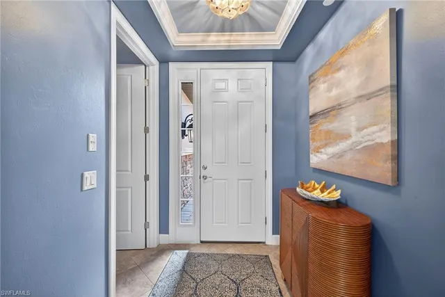 a view of an entryway with wooden floor