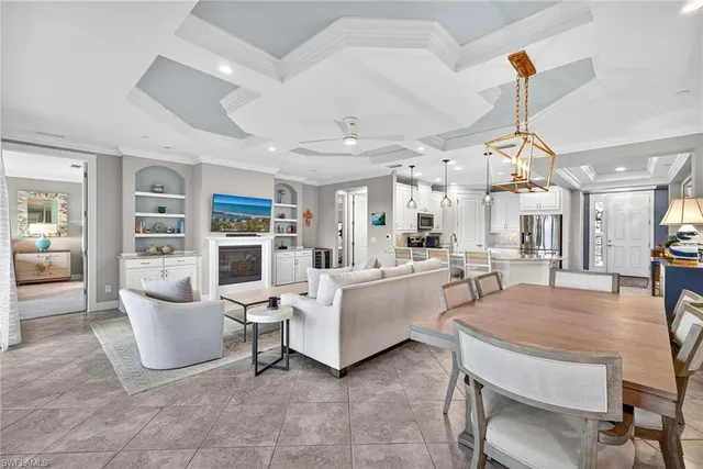 a living room with furniture a rug and white walls