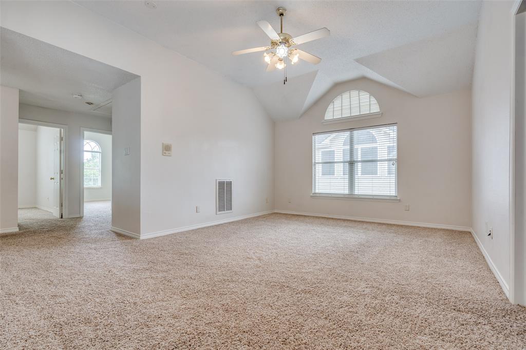3421 Neiman Road Plano, TX 75025 - Photo 27 of 40 Carpeted empty room featuring healthy amount of natural light, a ceiling fan, and lofted ceiling