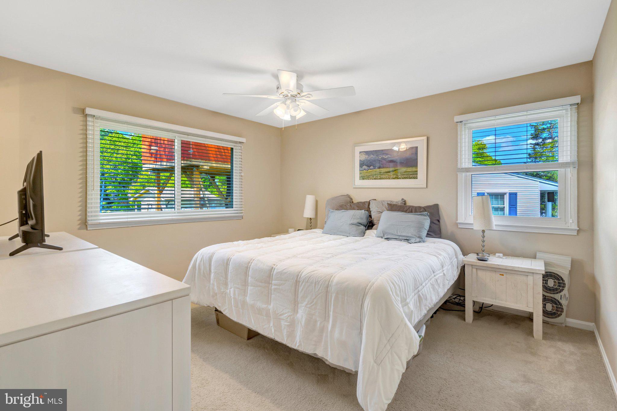 7212 Galgate Drive Springfield, VA 22153 - Photo 12 of 39 a bedroom with a bed and a window
