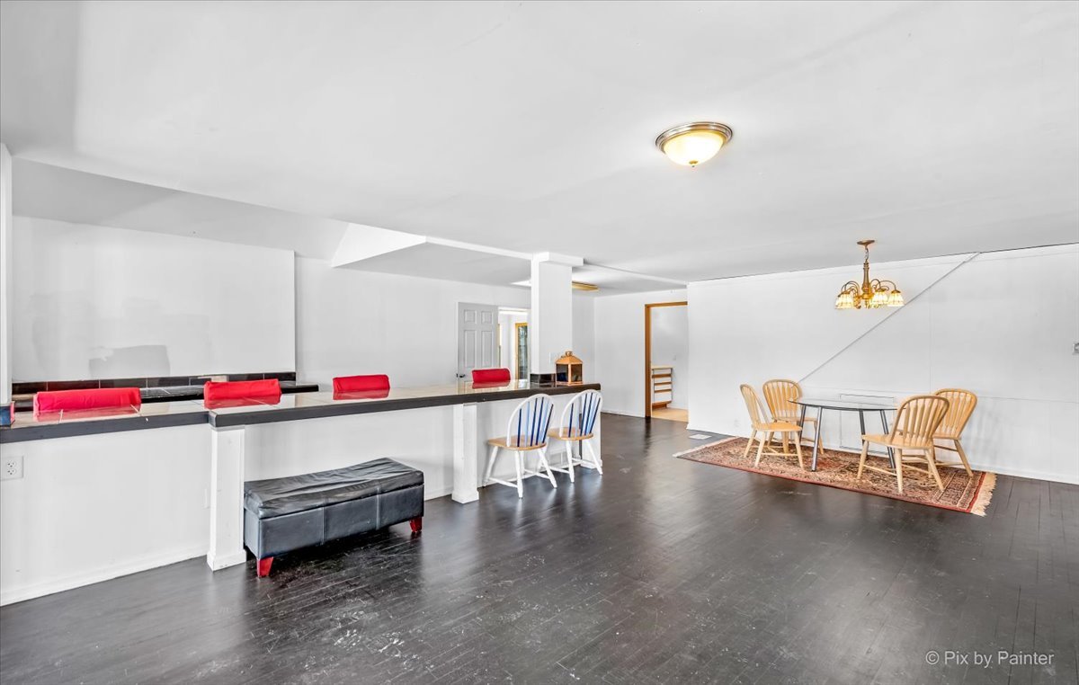 544 Hainesville Road Round Lake Park, IL 60073 - Photo 20 of 50 a room with wooden floors and a couch