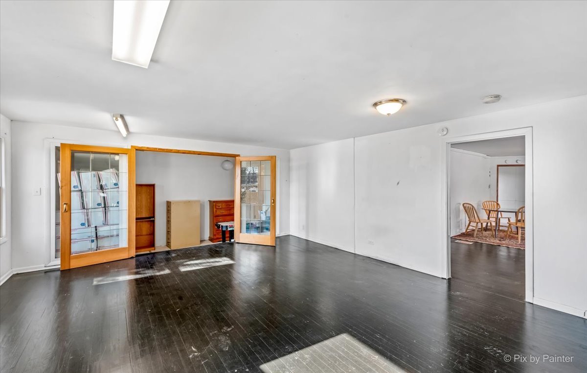 544 Hainesville Road Round Lake Park, IL 60073 - Photo 24 of 50 an empty room with wooden floor and windows
