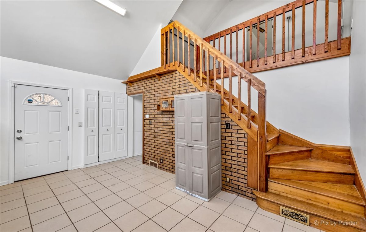 544 Hainesville Road Round Lake Park, IL 60073 - Photo 28 of 50 a view of entryway with stairs and wooden floor