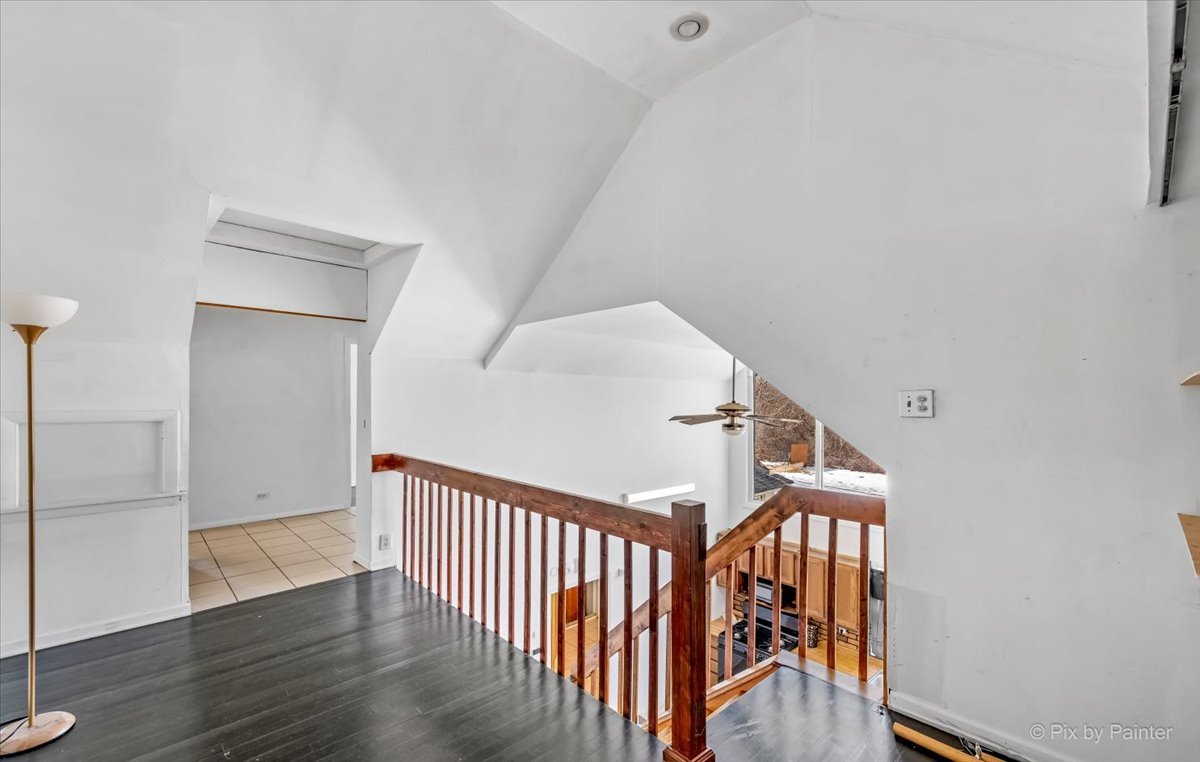 544 Hainesville Road Round Lake Park, IL 60073 - Photo 32 of 50 a view of a hallway with wooden floor and staircase