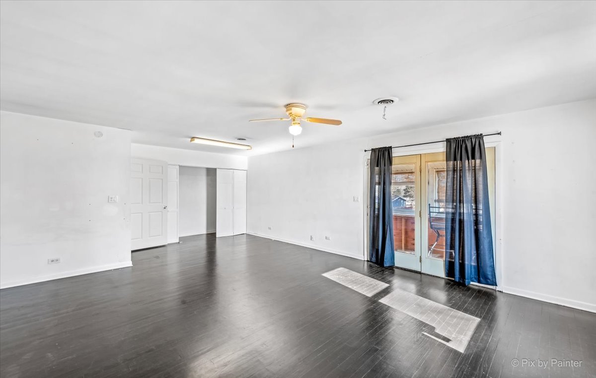 544 Hainesville Road Round Lake Park, IL 60073 - Photo 34 of 50 an empty room with wooden floor and natural light