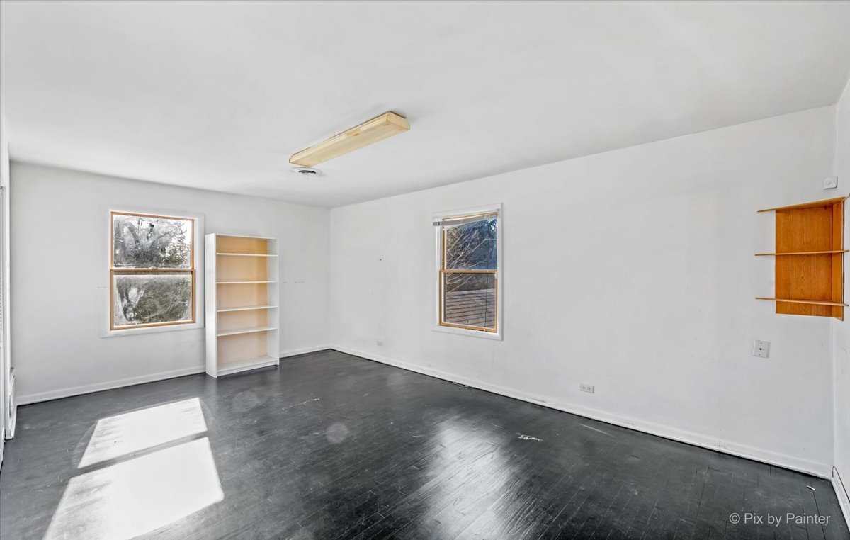 544 Hainesville Road Round Lake Park, IL 60073 - Photo 36 of 50 wooden floor in an empty room with a window