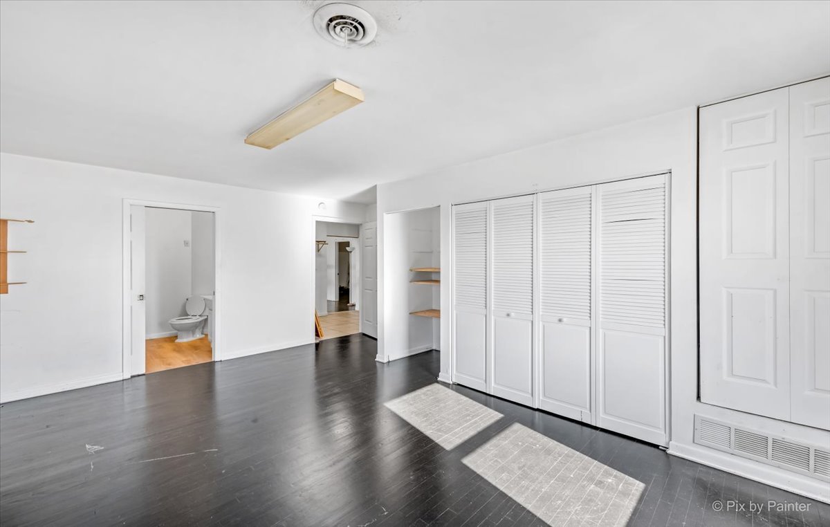 544 Hainesville Road Round Lake Park, IL 60073 - Photo 37 of 50 a view of an empty room with wooden floor