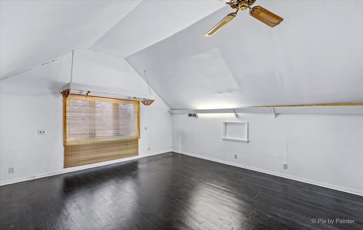 544 Hainesville Road Round Lake Park, IL 60073 - Photo 39 of 50 an empty room with wooden floor and windows