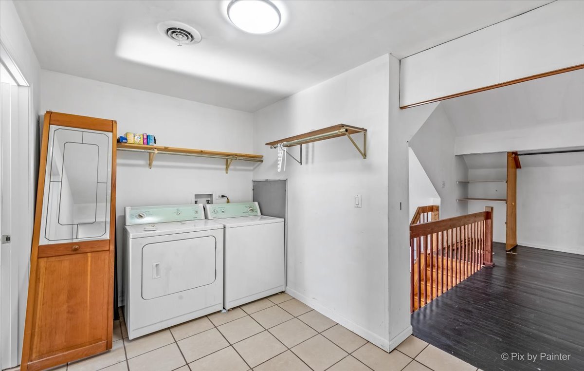544 Hainesville Road Round Lake Park, IL 60073 - Photo 40 of 50 a utility room with cabinets washer and dryer