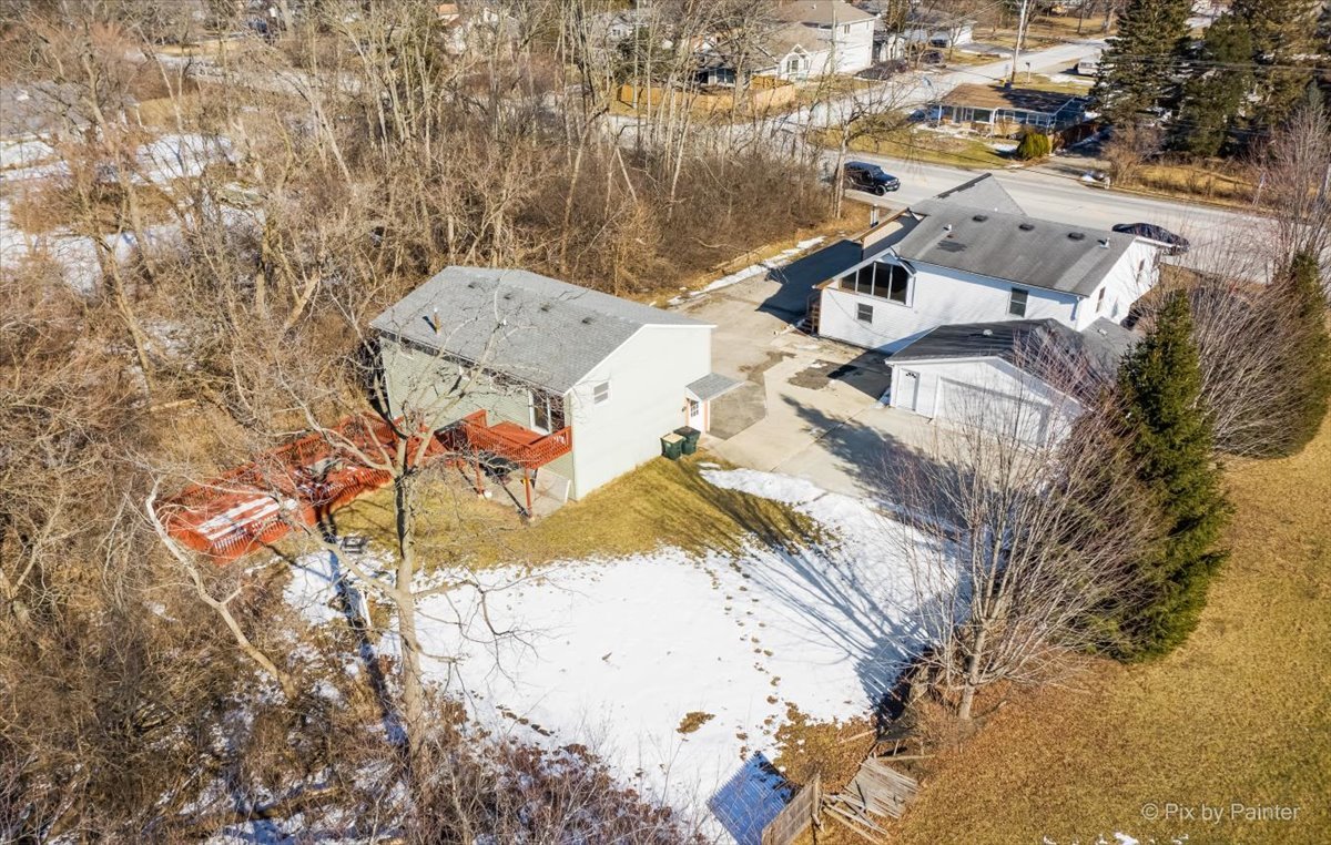 544 Hainesville Road Round Lake Park, IL 60073 - Photo 7 of 50 an aerial view of a house with a yard and covered with snow