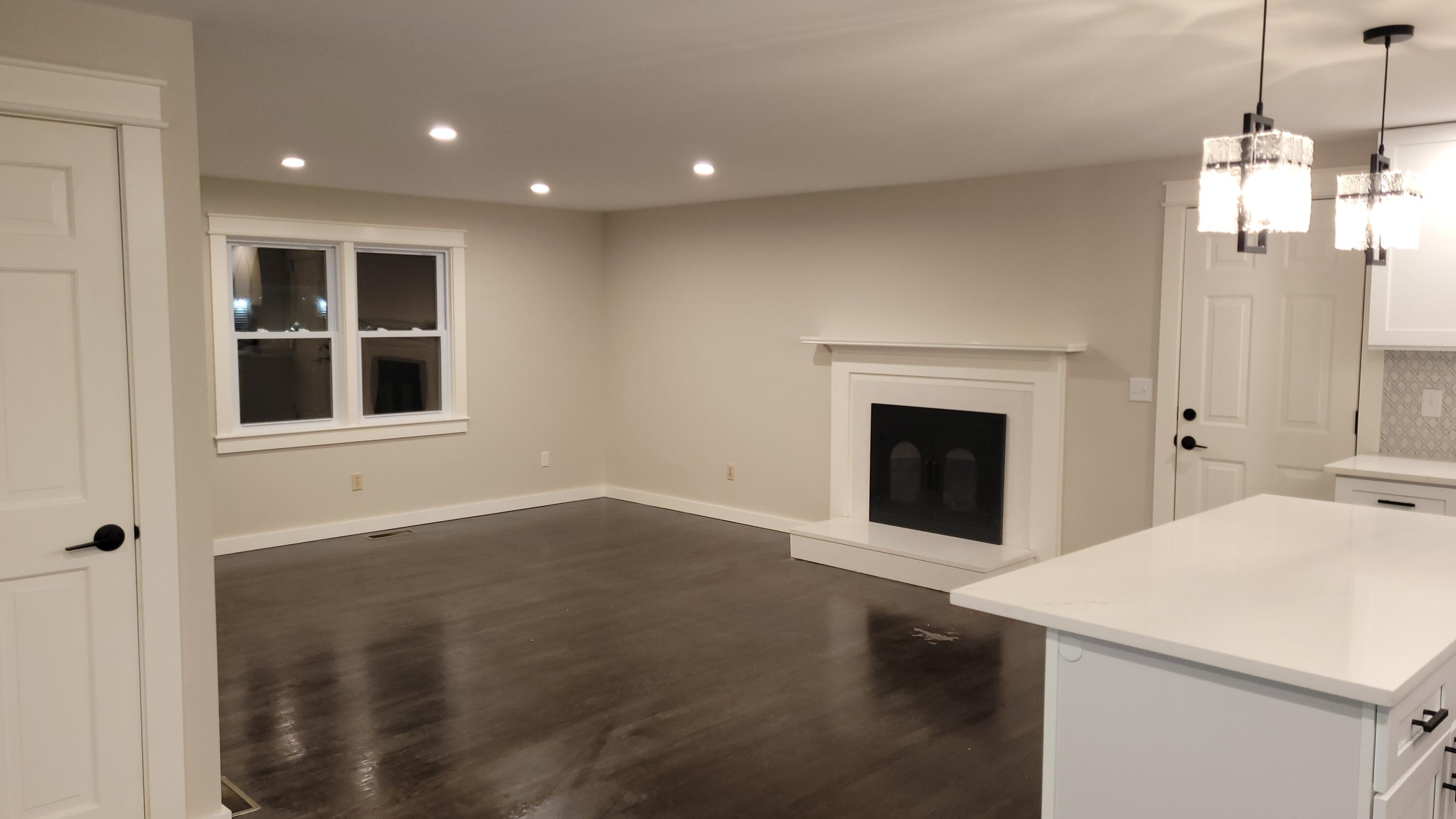20 Seth Parker Road Centerville, MA 02632 - Photo 6 of 24 a kitchen with a sink and a fireplace