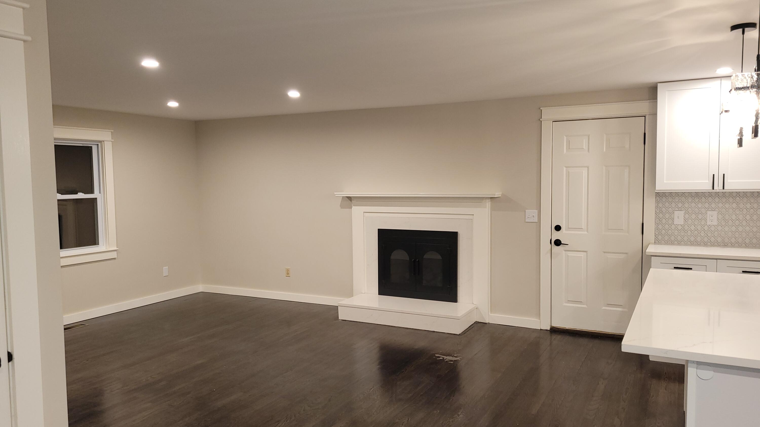 20 Seth Parker Road Centerville, MA 02632 - Photo 8 of 24 a view of an empty room with wooden floor and a fireplace