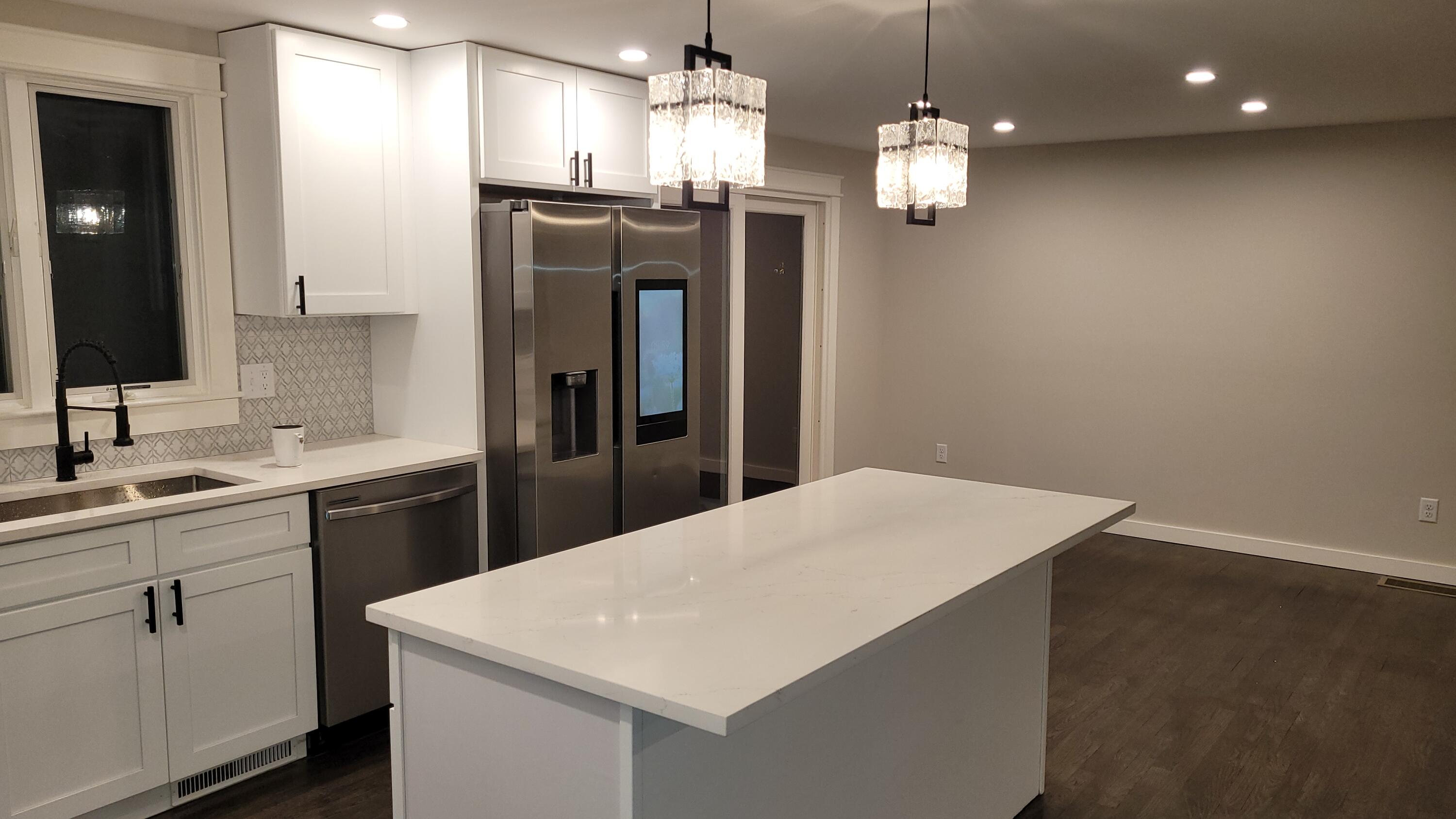20 Seth Parker Road Centerville, MA 02632 - Photo 9 of 24 a kitchen with a refrigerator a sink dishwasher a stove and white cabinets with wooden floor