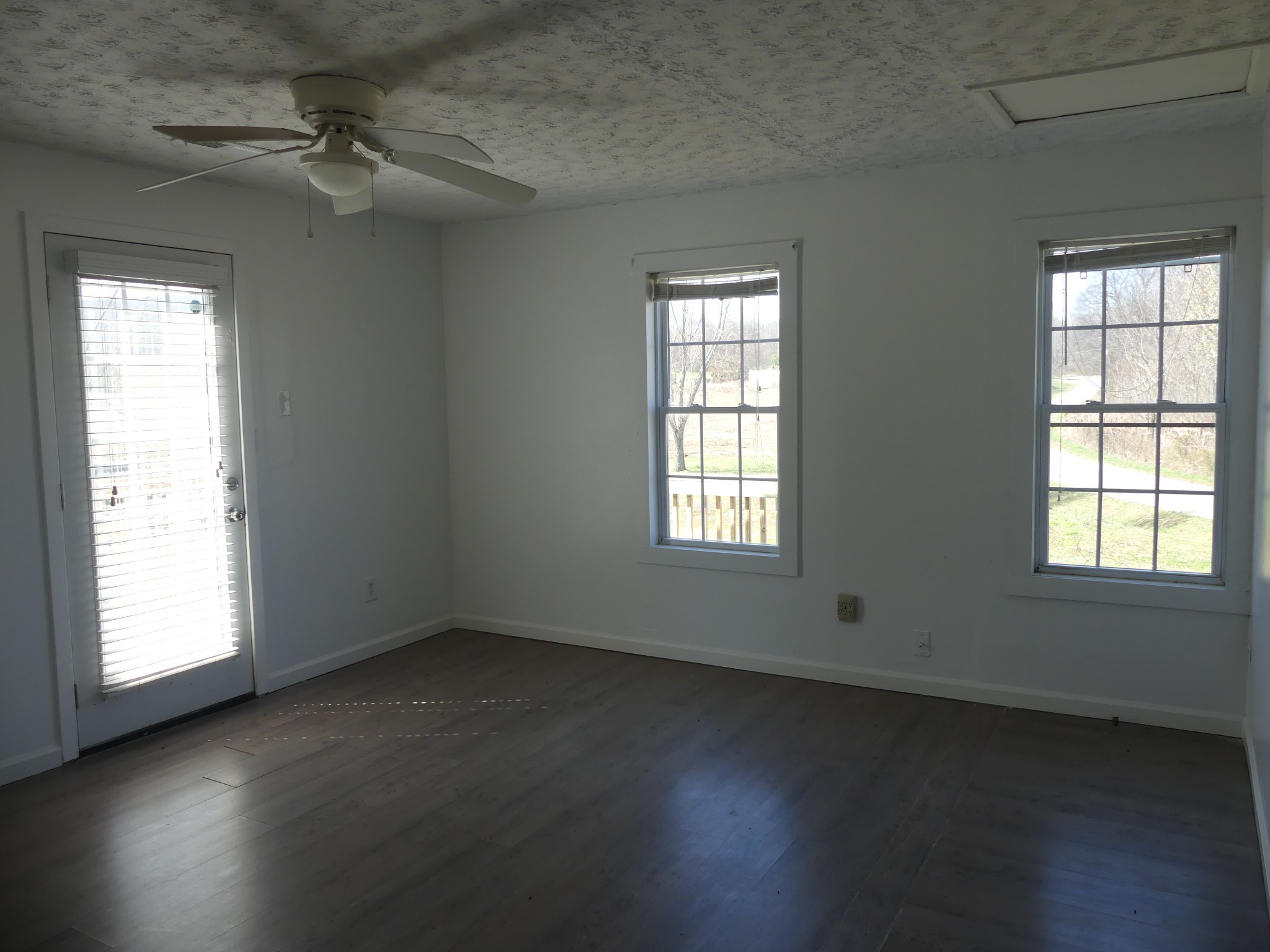 231 Mountain Road Elora, TN 37328 - Photo 17 of 32 an empty room with a window and wooden floor